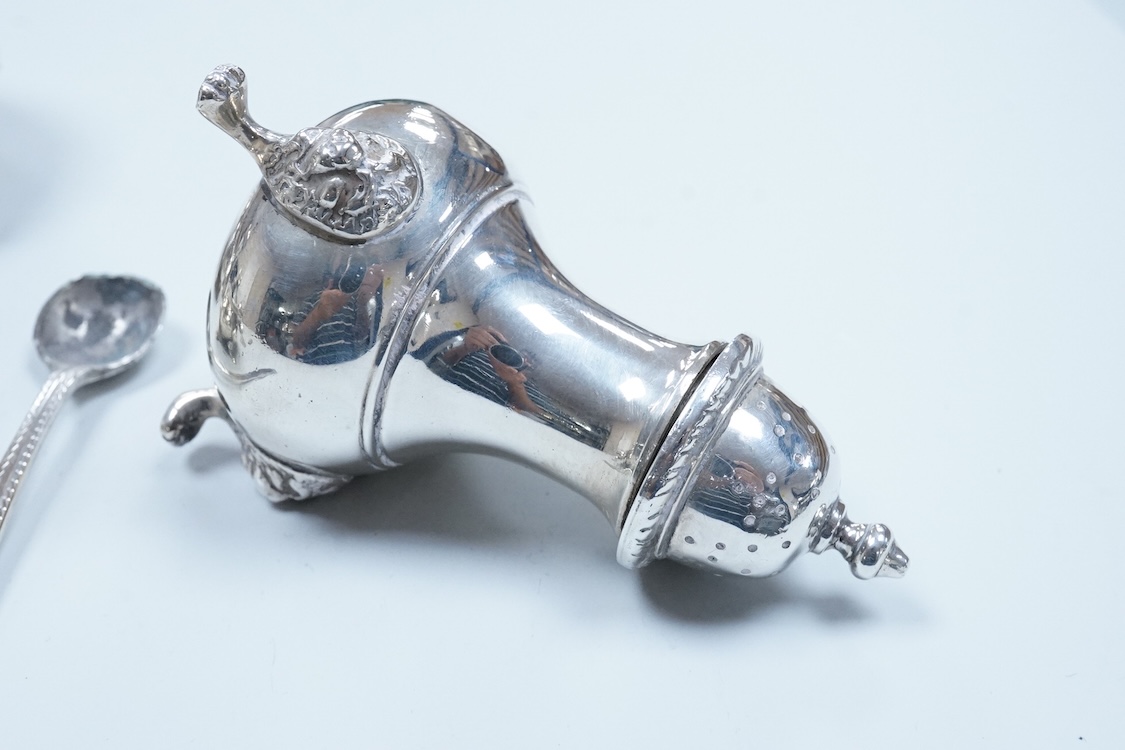 Two George VI silver three piece condiment sets by Walker & Hall, London, 1936/7, together with a modern silver mounted pepper mill by Mappin & Webb and two plated spoons.